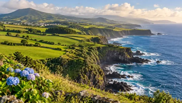 Travel to the Azores, Portugal: Which Islands to Start With 9 Green pastures above dark volcanic coastal cliffs on Sao Miguel in the Azores