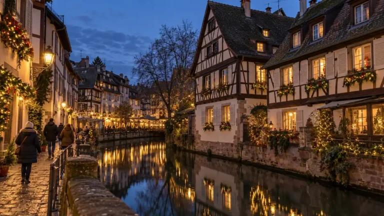Home 2 Christmas lights along half-timbered houses beside a canal in Petite France, Strasbourg